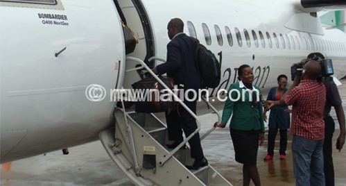 Passengers boarding Malawian Airlines plane at Chileka International Airport