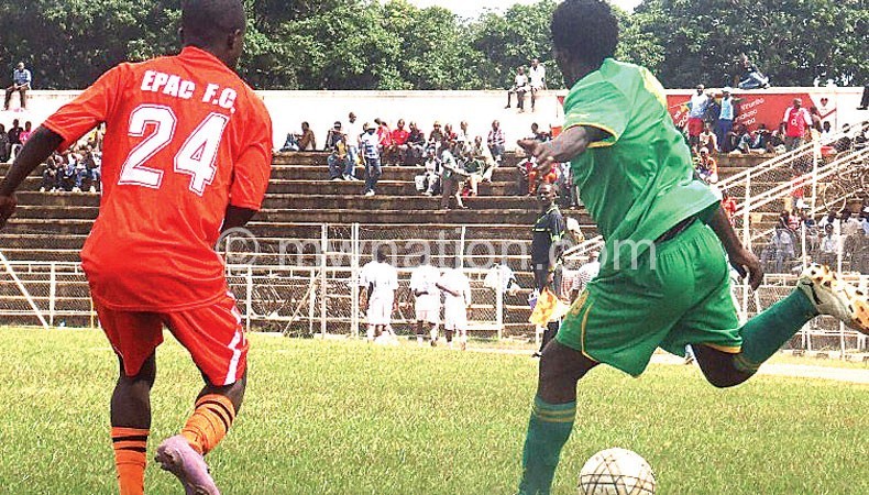 Civo’s Lawrence Mwehiwa (R) tries to beat an opponent during the match