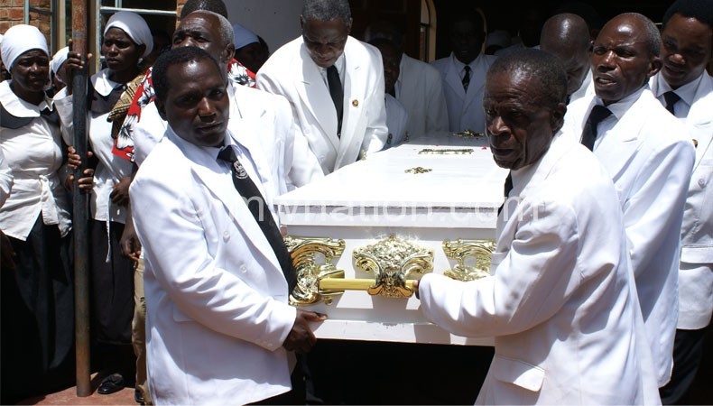Members of men’s guild carry Tito Banda’s coffin at Viyele on Thursday
