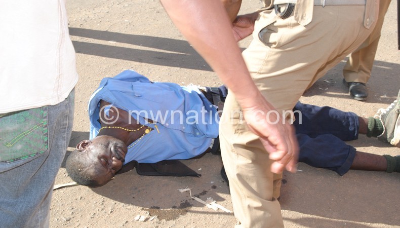 Malawi Police Service officers attending to one of the injured persons