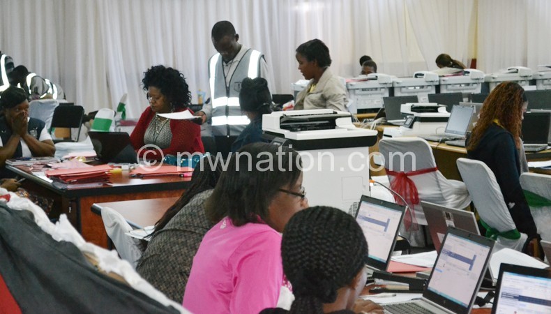 Business as usual: MEC staff computing data at the National Tally Centre in Blantyre  