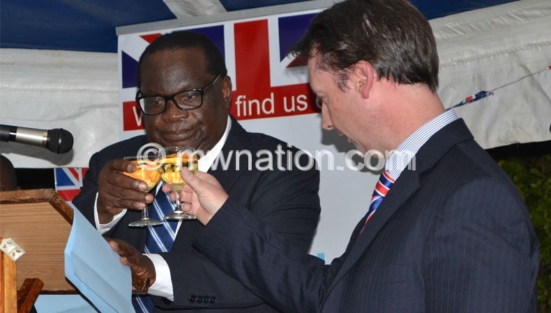 British eenoy to Malawi Nevin (R) and Goodall Gondwe toast at a recent function