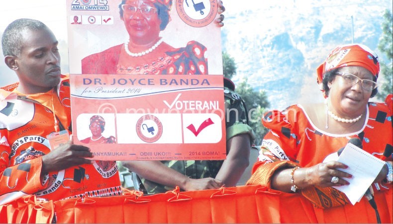 Can she mount a comeback: Banda (left) during a campaign trail 