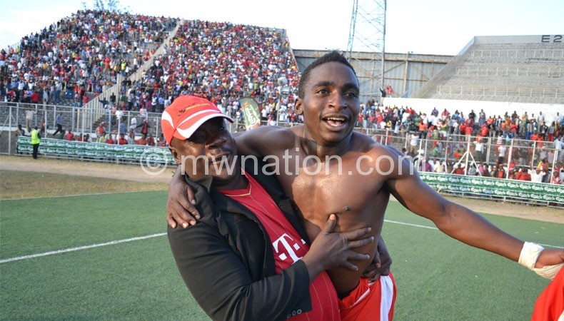 Mwamadi (L) celebrates with Musa Manyenje after a Big Bullets league win