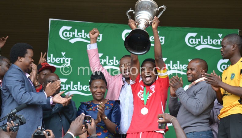 The jovial BB captain Henry Kabichi lifts the cup