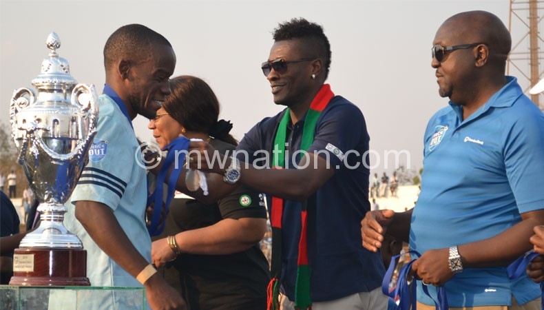 Ghana Captain Asamoah Gyan pledging support to the PTG project in Malawi last year