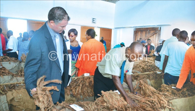 Buyers admire Malawi's green gold at an auction in Limbe, Blantyre