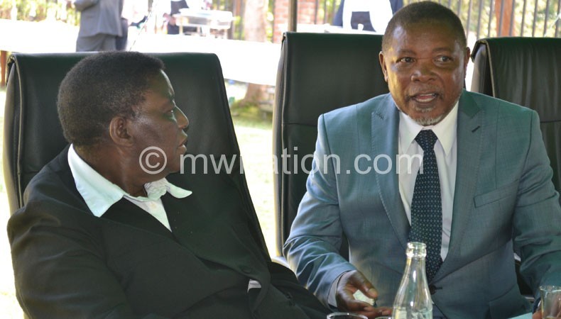 Msosa (L) and Munlo sharing notes on the sidelines of the party