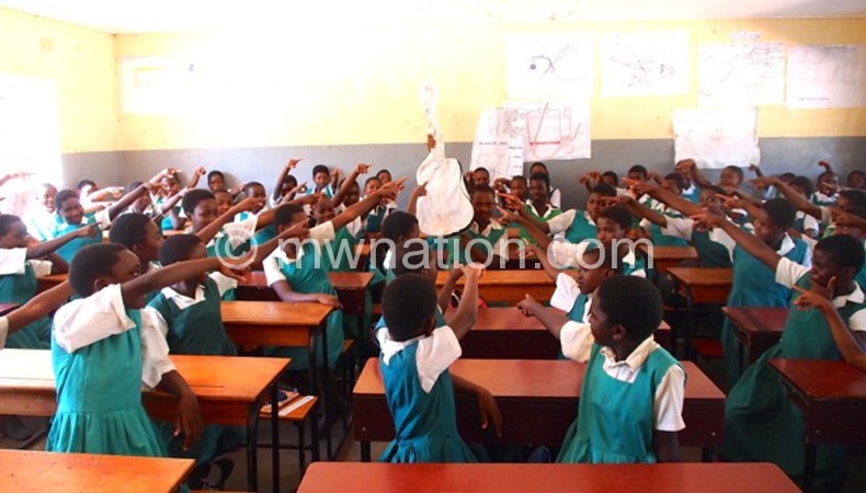 Blantyre Girls pupils point to their lone guiter