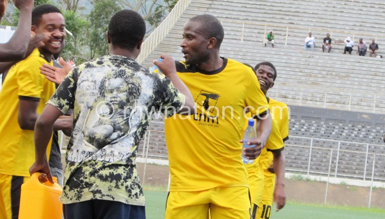 Chipatala (R) celebrates with teammates after scoring