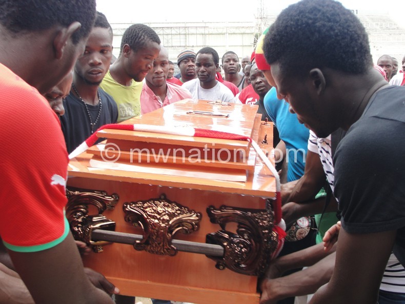 Bullets players carrying the casket