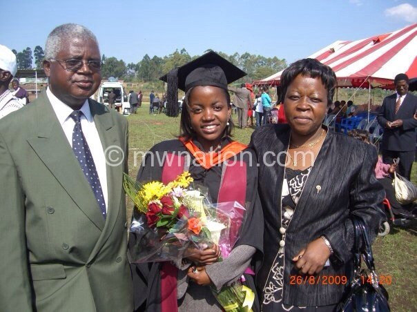 Dr Phiri flanked by her parents on her graduation
