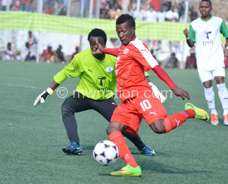 Bullets’ two-goal hero Chande (R) rounds off Surestream ‘keeper Makina