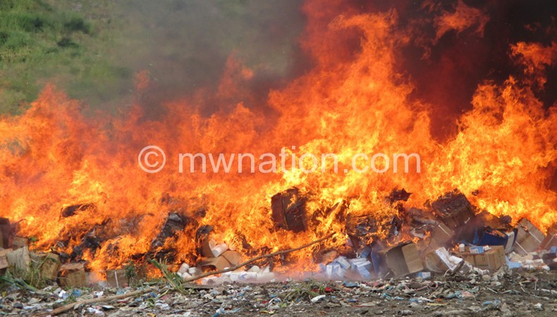 Up in flames: The expired drugs and medical supplies during the destruction in Blantyre yesterday