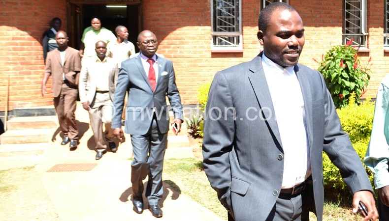Wapona Kita (foreground) and Kasambala walk out of court on Wednesday