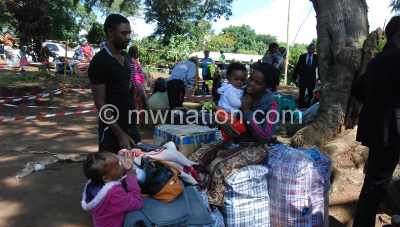 Home sweet home: A family relaxes prior to  heading home at Kwacha camp