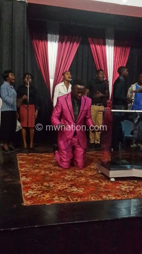 Evangelist Mlaka Maliro prays during a recent deliverance session