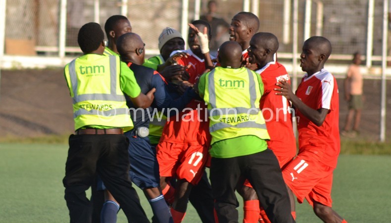 Red Lions players physically confronting Kapinga
