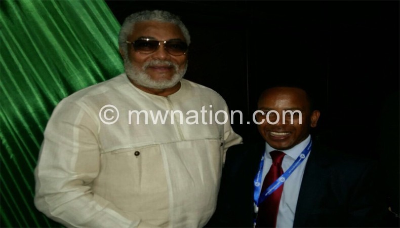 chalamba (R) with former Ghanaian president Jerry rawlings at the Summit