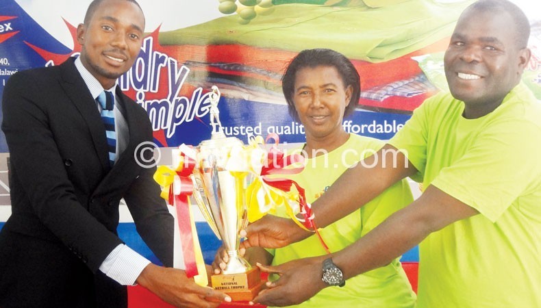 Candlex’s Bvalani receives trophy from  Mhango as Mpinganjira-Tasosa looks on