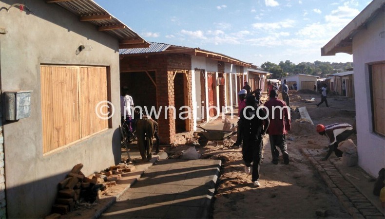 Fresh start: Workers engaged by market traders making final touches to the reconstructed Mzimba Market
