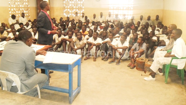 Inmates listen to Pastor Chawawa’s sermon