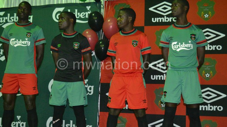 Flames players showcasing Umbro replicas during the launch last year 