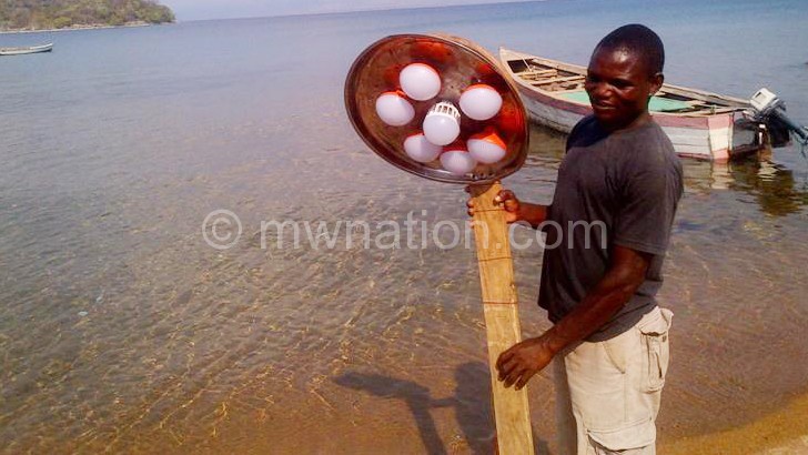 A man displays one of the new fishing technologies 
