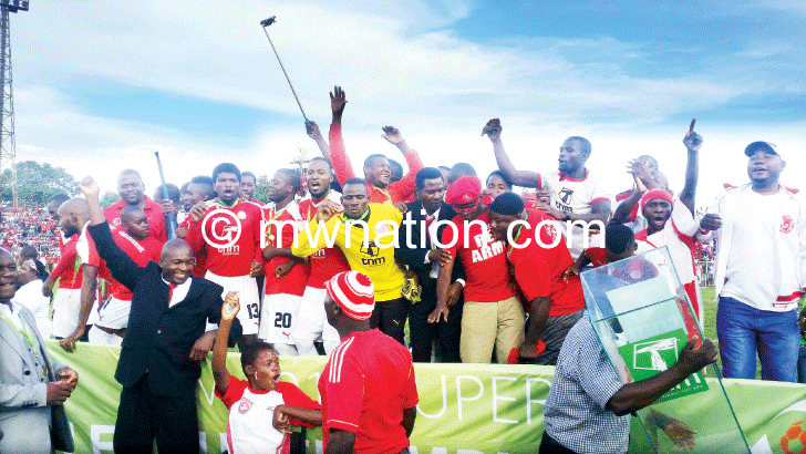 BB players and officials celebrate after being crowned champions