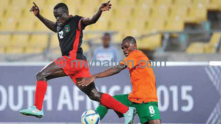 Flames midfielder Chimango Kayira (L) in action against Zambia during last year’s Cosafa tournament