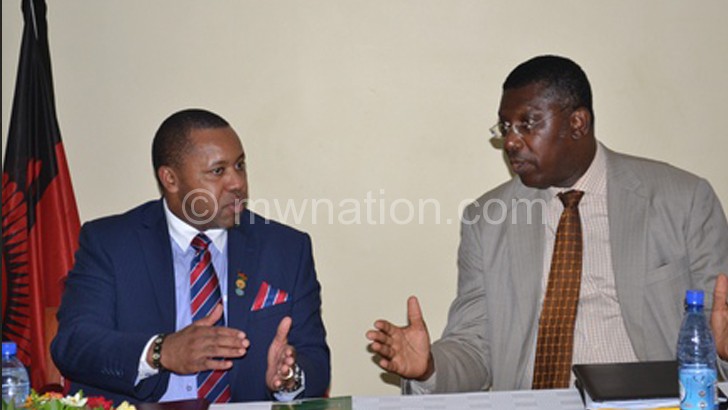 Chilima and Nyarko sharing notes during the forum yesterday