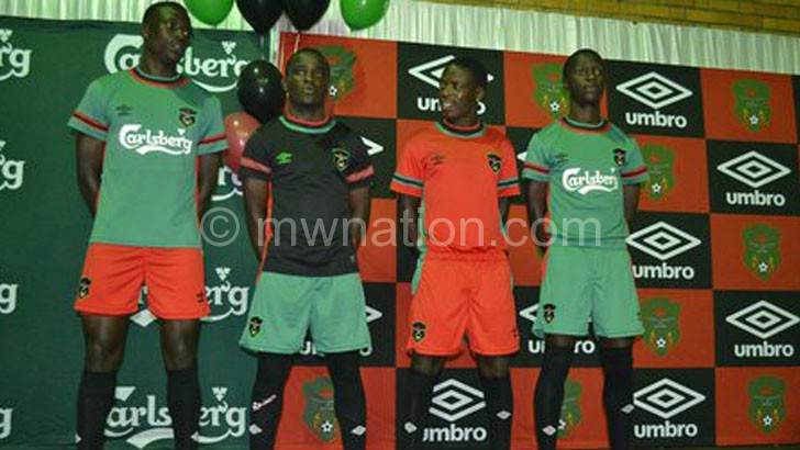 Flames players show off the Umbro jerseys during the launch