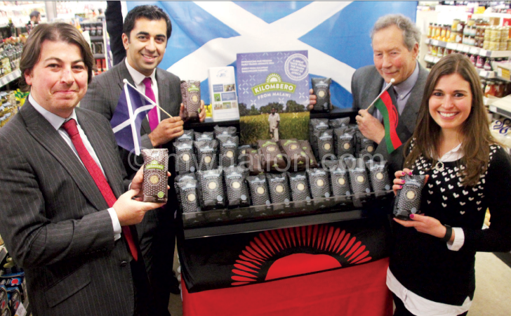 Yousaf (with Scottish flag) and JTS officials at the launch of rebranded Kilombero product 