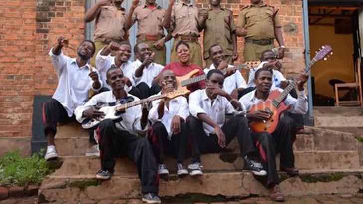 Zomba Prison Project band members strike a pose outside the makeshift studio at Zomba Central Prison