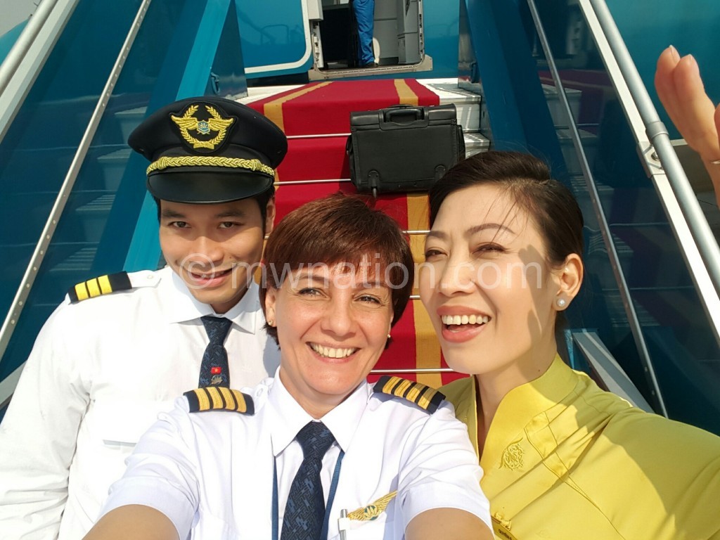 Foy (C) with colleagues at Vietnam Airlines