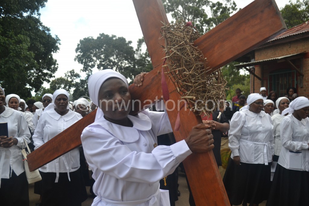Christians of St Micheal and All Angels take part in the Way of the Cross yesterday