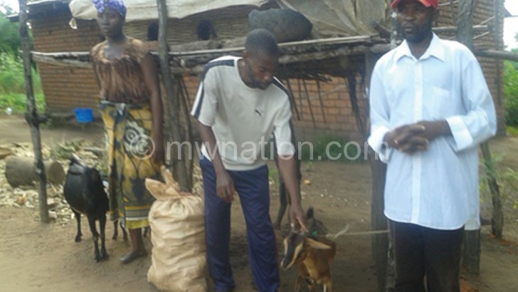 Some of the beneficiaries with their goats 
