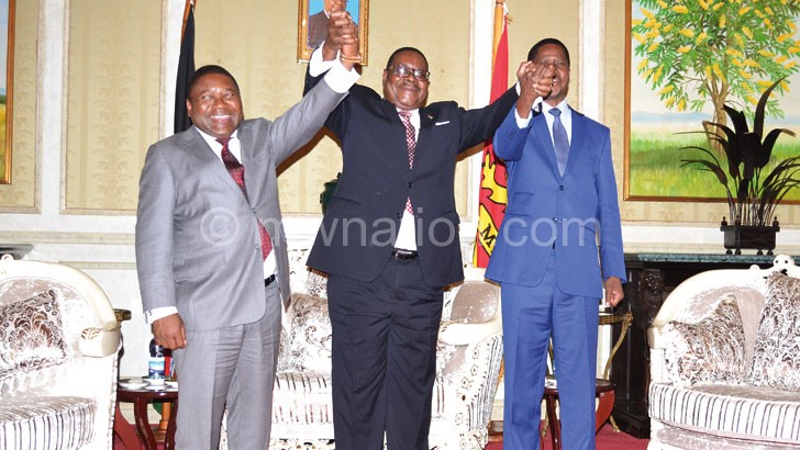 United we stand: Mutharika holds hands with Nyusi (L) and Lungu (R)