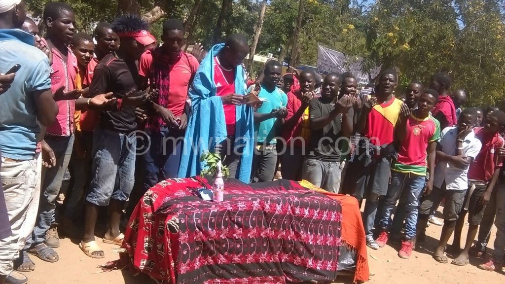 Some of Bibi Kuluunda’s subjects stage a protest with a mock funeral service at the DC’s office