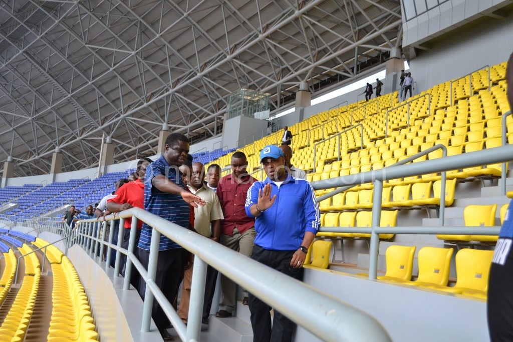 Chilima (R) being briefed on some of the facilities at the stadium by chief architect in the Ministry of Transport and Public Works Knight Munthali (L)
