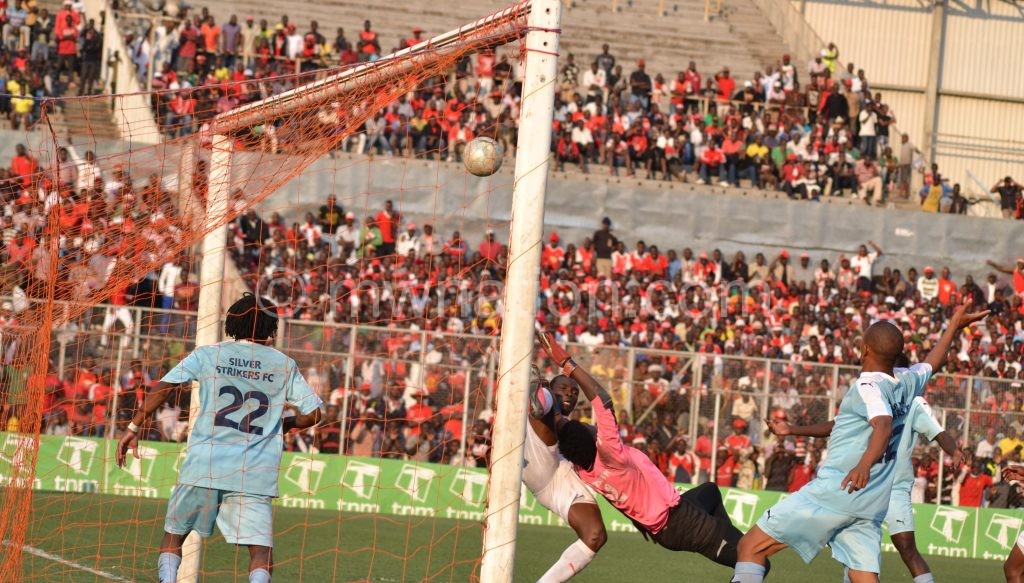 Silver’s ‘keeper Munthali (in pink top) fails to save Mlozi’s scissors-kick