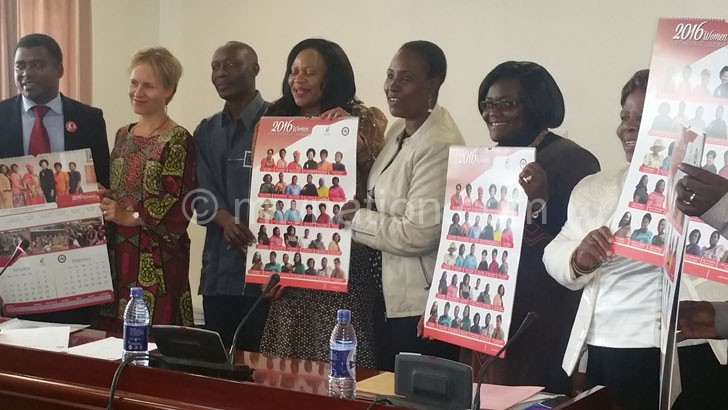 Women MPs, UN representatives and other MPs display the women caucus calendar launched on Fridaypreviously