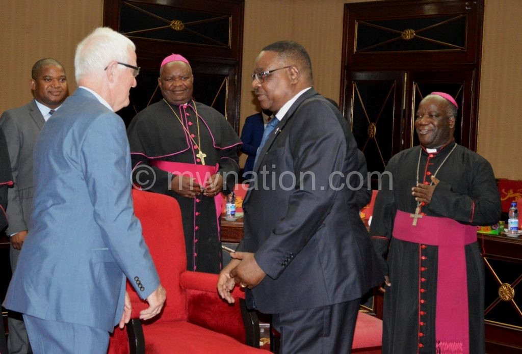 Mutharika greets Ryan during a recent meeting with Catholic Bishops at Kamuzu Palace