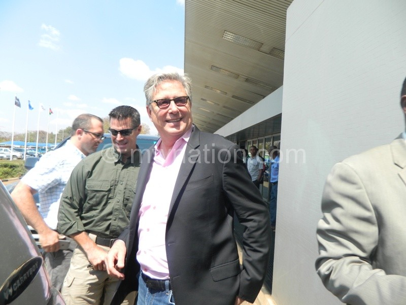 Don Moen (R) smiles at a sizeable crowd that came to welcome him at the Kamuzu International Airport