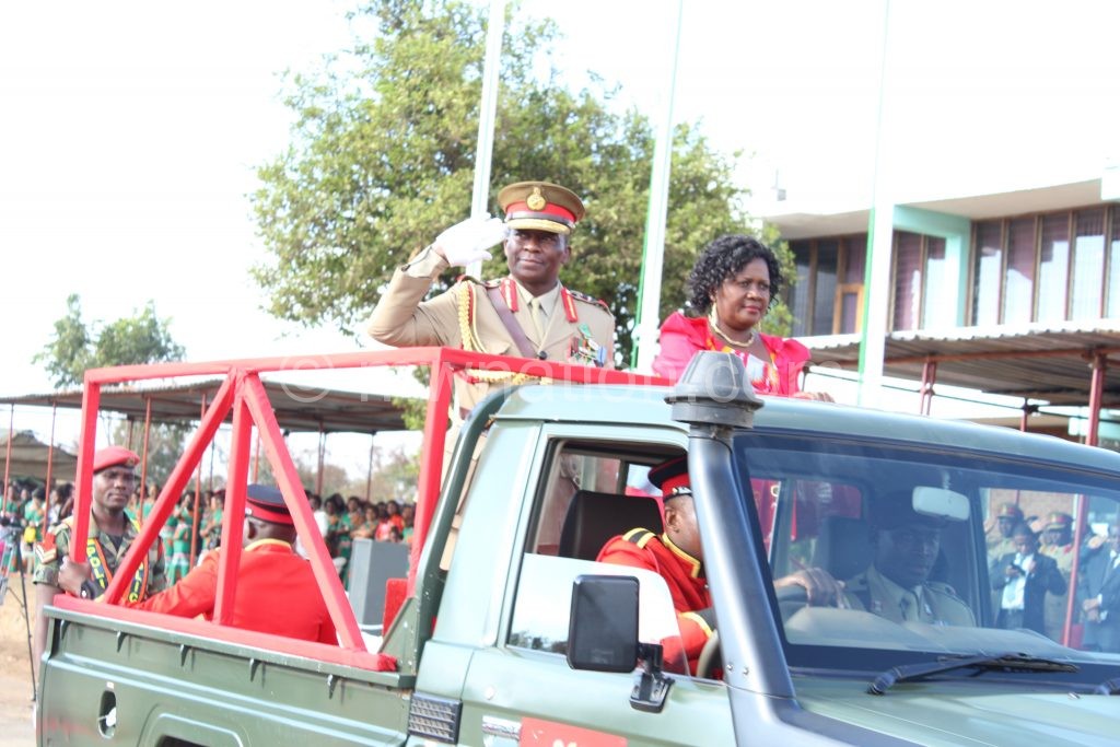 Supuni-Phiri and his wife being escorted out of the parade 
