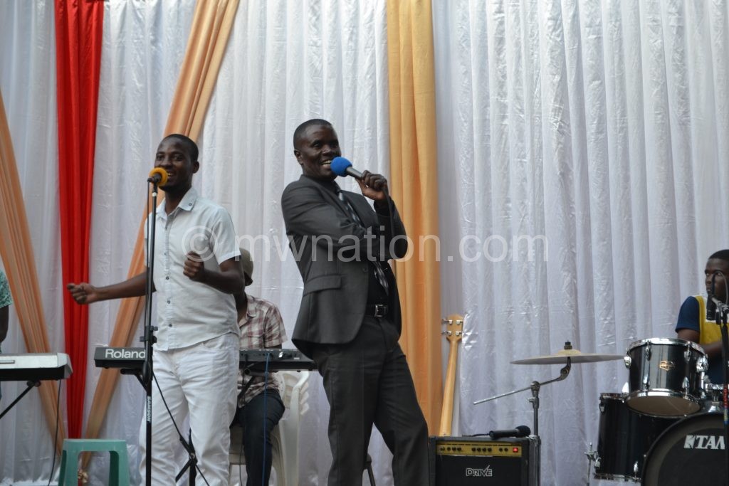 Ngumuya (R) performing during the event