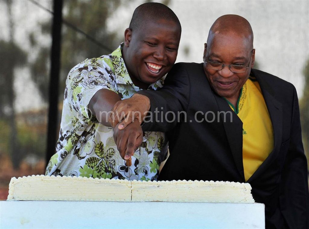 Comrades at war: Malema (L) with Zuma during their ANC days