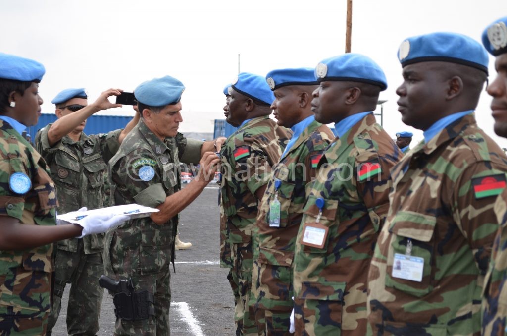 MDF soldiers being decorated during a peace-keeping mission in DRC