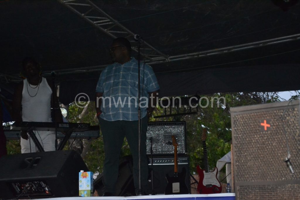 Lucius Banda waits on stage for power to be back for him to perform