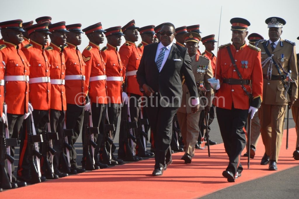 Mutharika inspecting a guard of honour at Kamuzu International Airport on arrival from UNGA